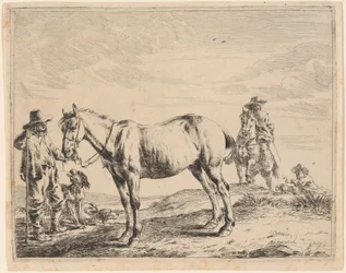 Un homme tenant un cheval par sa bride