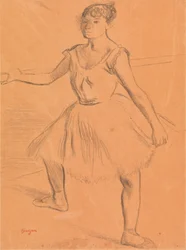 Ballerine debout à une barre