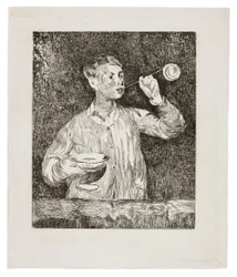 Garçon soufflant des bulles de savon
