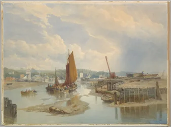 Une ville sur un estuaire à marée basse