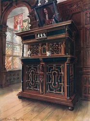 Un cabinet en chêne et noyer, avec panneaux et colonnes en ébène, incrusté de bois de rose et d
