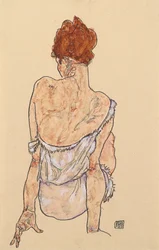 Femme assise en sous-vêtements, vue de dos