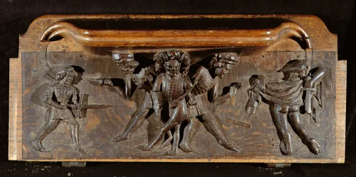 Une miséricorde endommagée représentant trois hommes se battant avec des poignards et des épées, New College Chapel, Oxford, fin du 14ème siècle