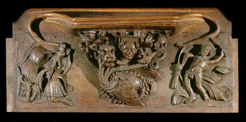 Une miséricorde représentant une hydre finement sculptée, symbolique des sept péchés capitaux, incorporant une tête humaine réaliste, New College Chapel, Oxford, fin du 14ème siècle