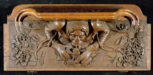 Une miséricorde représentant un ogre avec des épaules énormes, New College Chapel, Oxford, fin du 14ème siècle