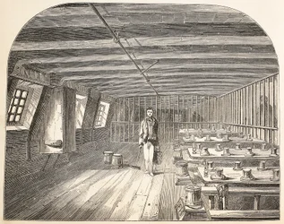 Un quartier à bord du Defence hulk aménagé pour le retour des condamnés au dîner, illustration de The Criminal Prisons of London and Scenes from Prison Life par Henry Mayhew et John Binny, pub. 18