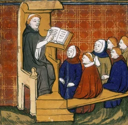 Enseignant dominicain, assis avec un livre placé sur un lutrin, avec des élèves assis par terre devant lui. "Livre des Propriétés des Choses", début du XVe siècle.
