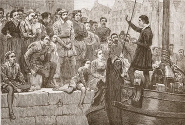 Nicolas prêchant à la foule depuis un bateau sur l