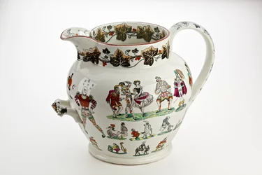 Cruche Staffordshire décorée de figures d