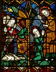 La fenêtre est représentant une scène de Résurrection : les Saintes Femmes au Tombeau; Marie-Madeleine avec le Christ?