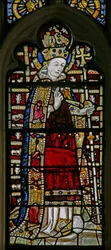 Fenêtre Ew représentant Saint Thomas Becket avec des bijoux en verre incrusté
