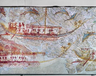 Des navires entourés de dauphins