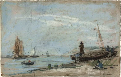 Plage avec bateaux de pêche et charbon