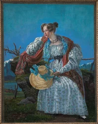 Jeune femme assise dans un paysage norvégien
