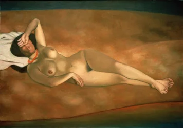 Femme couchée sur le sable