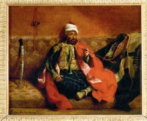 Turk fumant, assis sur un divan - Turk, smoking on a divan ...