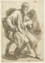 Homme assis dans un fauteuil