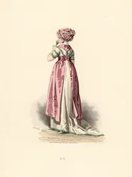 Femme en robe blanche et corsage avec garniture verte, tablier rose