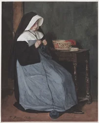 Une nonne assise à une table tricotant