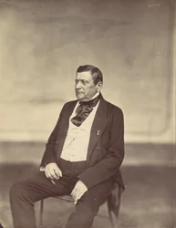 [Homme assis en gilet blanc et manteau sombre], années 1850-1860