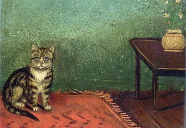 Le chat assis sur le tapis