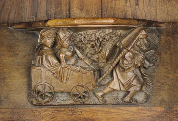Sculpture représentant un couple dans une charrette tirée par un homme, d
