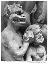 Diable poussant une personne damnée dans le feu, du Jugement Dernier de la Cathédrale Saint-Étienne de Bourges (détail)