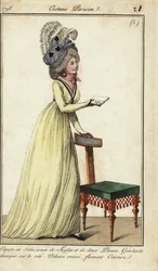 Femme à la mode avec une chaise