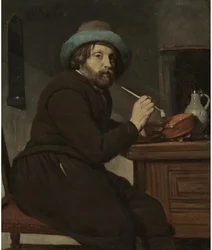 Fumeur assis à une table