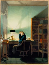 Homme lisant à la lumière d