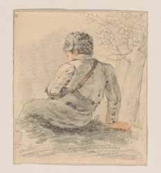 Garçon assis, vu de dos
