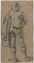 Un homme debout vu de dos
