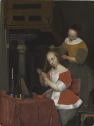 Femme assise à ses toilettes