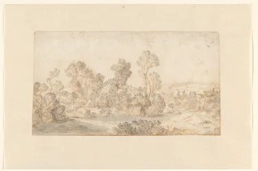 Paysage vallonné avec de grands arbres le long d