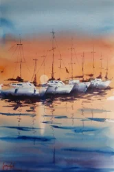 Des voiliers au coucher du soleil