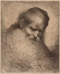 Vieil homme avec une longue barbe et une calotte, penché en avant