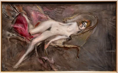 Femme nue sur des coussins roses