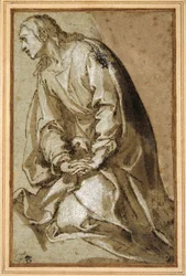 Un jeune saint agenouillé en prière