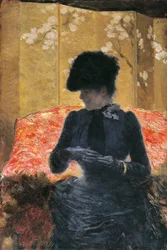 Femme sur un canapé rouge