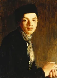 Un jeune homme, à mi-corps, portant un chapeau noir et un foulard, vers 1911