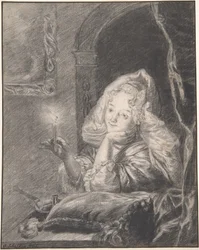 Jeune femme assise à une table, tenant une bougie