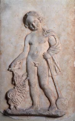 Magna Graecia : petit garçon jouant, relief en marbre, Ve siècle av. J.-C.