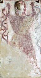 Peinture polychrome sur pinax et relief représentant une divinité féminine avec un serpent de l