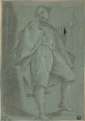 Homme debout avec bâton