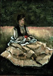 Femme assise sur la pelouse