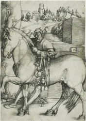 Un palefrenier bridant un cheval
