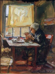 Vieille femme à la table du petit déjeuner