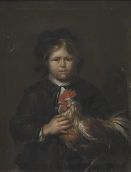 Un garçon de ferme avec un coq