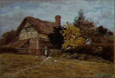 Laburnum Cottage : une femme nourrissant des canards