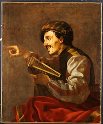 Un luthiste assis pointant